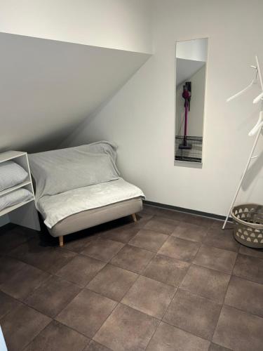 a room with a bed and a mirror on the wall at Le Channel in Camiers