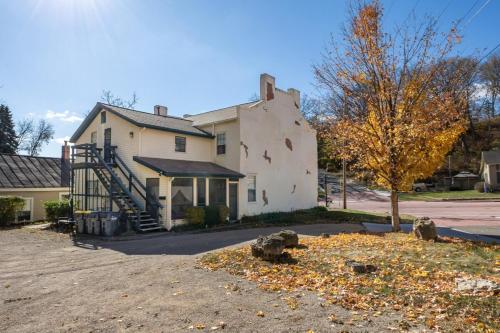 a white house with a tree in front of it at Briarstone Inn Unit 6 in Galena