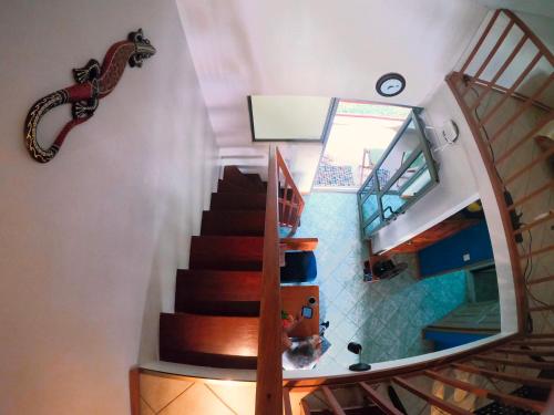 a spiral staircase in a house with a stair case at Samara Beach Las Palmeras Condo with Ocean view in Sámara