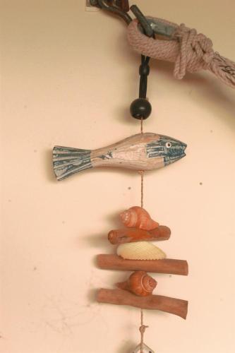 a wall with a wooden spoon and some spices at Samara Beach Las Palmeras Condo with Ocean view in Sámara