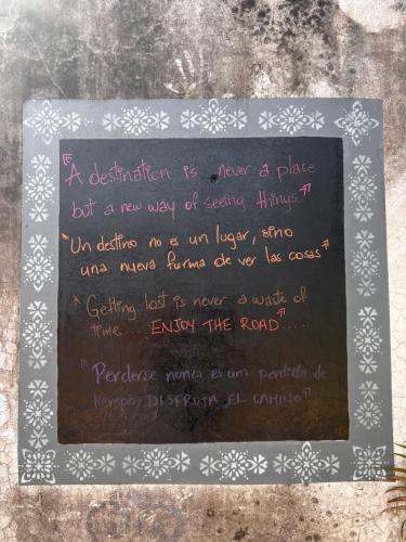 a chalkboard with a writing on it at Casa Colonial in León
