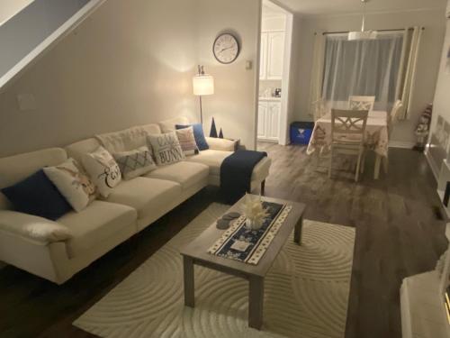 a living room with a couch and a table at Bernice Mae's Ocean View in Lewisporte