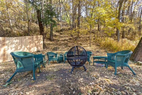 a group of green benches in a park at Briarstone Inn Unit 7 in Galena