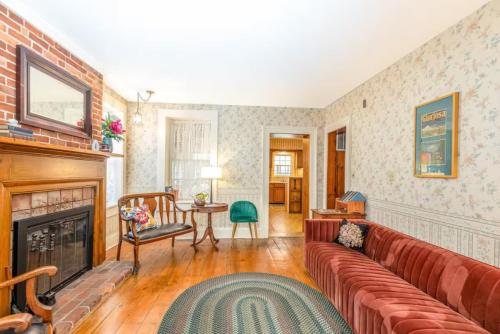 a living room with a couch and a fireplace at Briarstone Inn Unit 7 in Galena