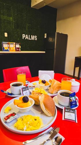 a plate of breakfast food on a red table at Huara Hs in Tacna