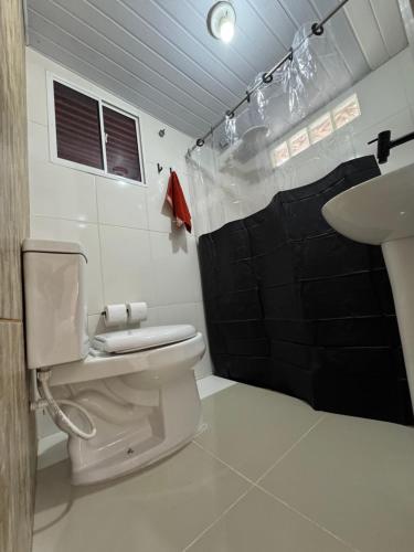 Koupelna v ubytování Mini Kitnet perfeito viajantes e executivos