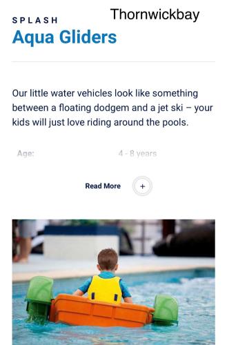 a little boy riding in a raft in a pool at Jay 35 4 bed sleeps up to 8 dog friendly caravan Thornwickbay haven site on East coast in Flamborough