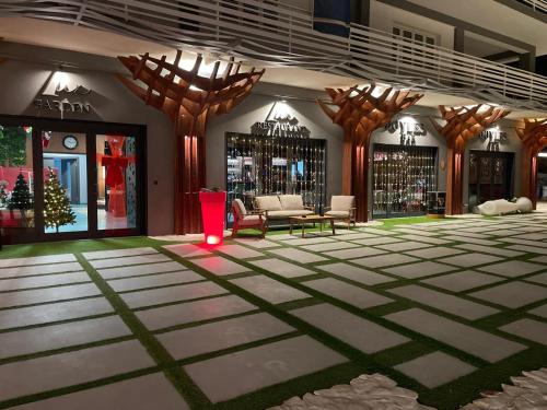 a lobby with a christmas tree in a store at Lux Home & Garden in Lago