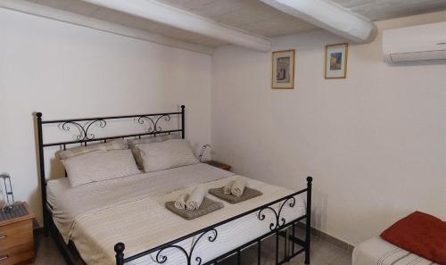Postel nebo postele na pokoji v ubytování Agriturismo La Valletta