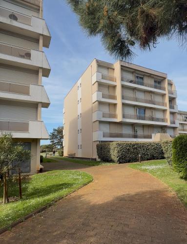 a large apartment building next to a building at Vue mer in Arcachon