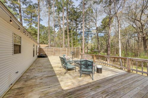 a wooden deck with two chairs and a table on it at 2 Mi to Downtown Work and Play at El Dorado Getaway in El Dorado