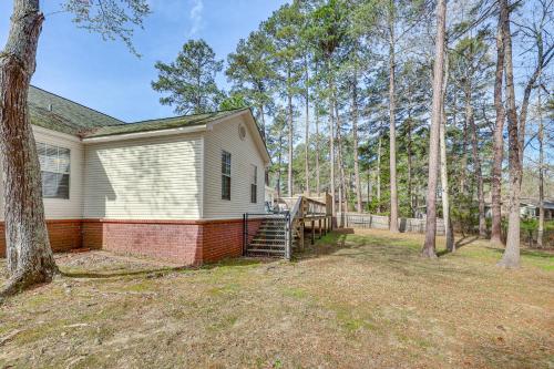 a house with a staircase in a yard at 2 Mi to Downtown Work and Play at El Dorado Getaway in El Dorado