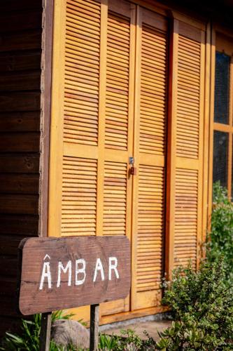a sign in front of a building that says amararma at Figueira do Rio do Boi Com Hidromassagem in Praia Grande