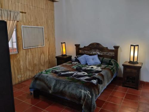 Voodi või voodid majutusasutuse 2460 Hostal Café Bar Glamping toas