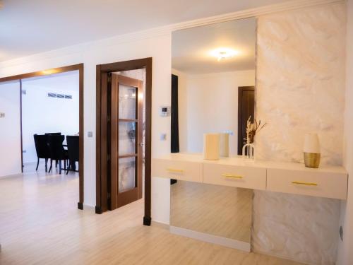a bathroom with a sink and a mirror at Appartement Haut Standing Mobilart Oran in Oran