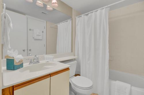 a bathroom with a sink and a toilet and a shower at Shipwatch 321D by Wild Dunes, Oceanfront Condo in Isle of Palms
