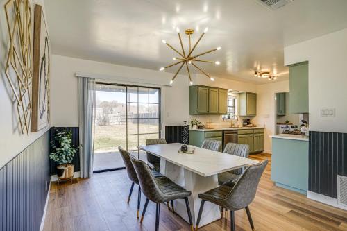 a kitchen and dining room with a table and chairs at 7 Mi to Lake Bridgeport Home with Yard and Grill! in Bridgeport