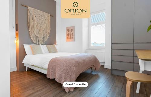 a bedroom with a bed with a blanket on it at The Kepties 3 - Luxurious Serviced Apartment by ORION SHORT STAYS in Arbroath
