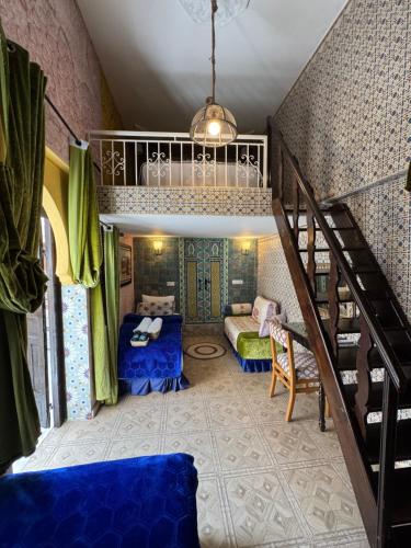 a room with a bunk bed and a staircase at RIAD ESMERALDA By Dar Ouezzani in Rabat