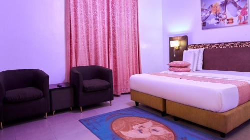 Ένα ή περισσότερα κρεβάτια σε δωμάτιο στο Crownedge Hotels