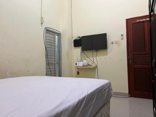 Телевизор и/или развлекательный центр в Hotel O Ziza Kost82 Syariah