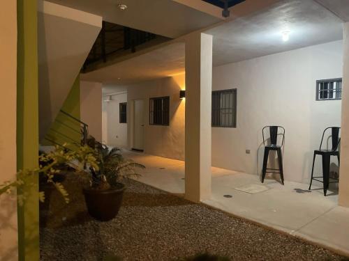 a living room with a table and chairs in a room at LiV109 Norte Depa 3 in Cd Obregon in Ciudad Obregón