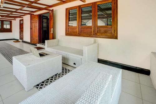 Cama o camas de una habitación en SPOT ON 93014 Griya Nautika Sukodono