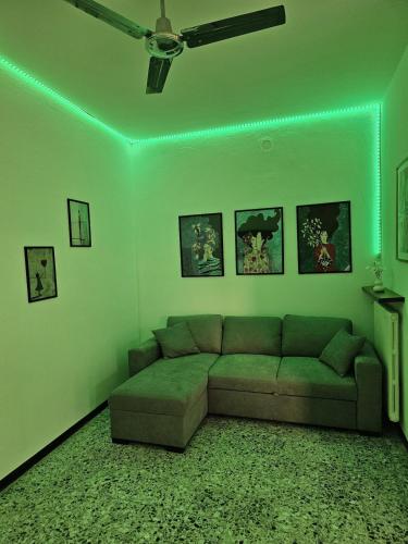 a living room with a couch and a green light at Bella Vista da Mario, Lake Como, Front Lake Blevio in Blevio