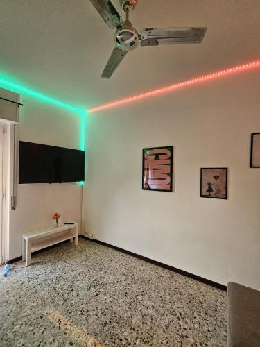 a living room with green lights on a white wall at Bella Vista da Mario, Lake Como, Front Lake Blevio in Blevio
