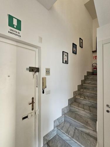 a staircase in a house with a door and a stairwell at Bella Vista da Mario, Lake Como, Front Lake Blevio in Blevio
