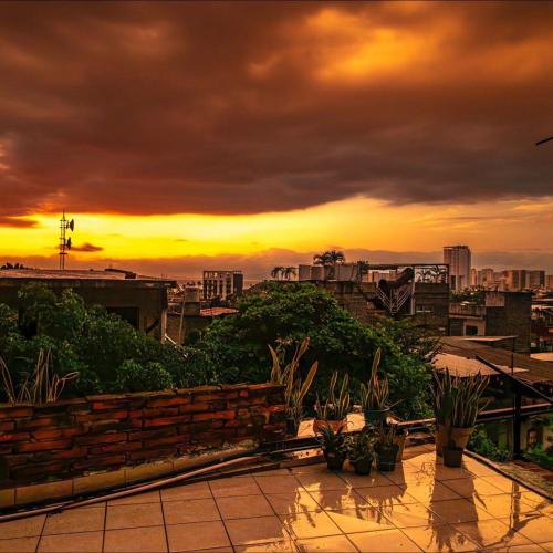 a view of a sunset from a rooftop at Residencia Acosta #2 in Puerto Vallarta