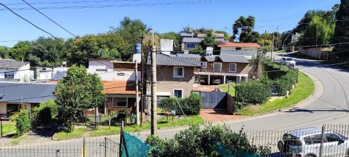 an empty street in a residential neighborhood with houses at La Rufina chalet serrano in Río Ceballos