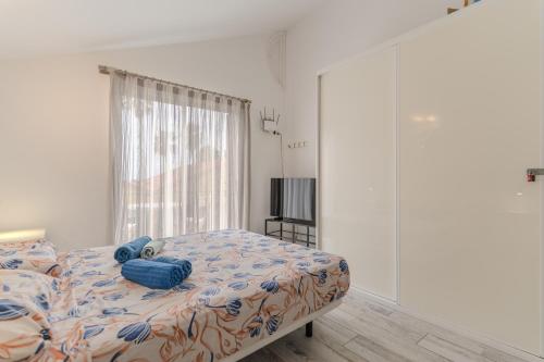 a bedroom with a bed with a teddy bear on it at Renovated Villa in Las Americas Sea Coast in Playa de las Americas