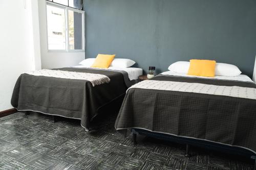 Ένα ή περισσότερα κρεβάτια σε δωμάτιο στο Central Hostel Dolce Vita