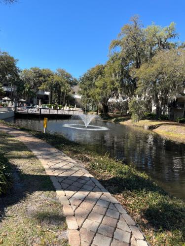 a fountain in a pond in a park at 13 Beach Stop Hilton Head in Hilton Head Island