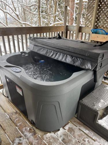 a large tank of water sitting on a deck at Irish Mountain Suites in Meaford