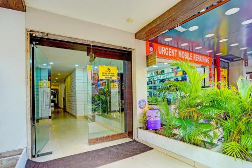 a store front of a store with plants in it at Hotel O Sunshin Deluxe in Nagpur