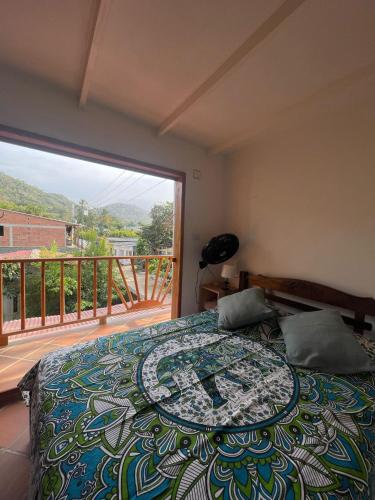 a bedroom with a bed and a balcony at Sistarasta in Palomino