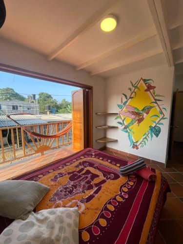 a bedroom with a bed and a balcony at Sistarasta in Palomino