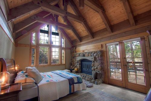 a bedroom with a large bed and a fireplace at THC0649 - Third Creek Comfort in Incline Village