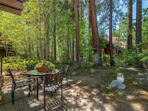 a table and chairs in a yard with trees at THC0649 - Third Creek Comfort in Incline Village