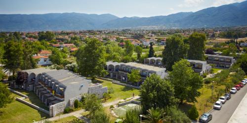 an aerial view of a city with trees and buildings at Olympian Bay Grand Resort in Leptokarya