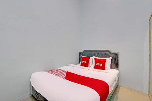 Katil atau katil-katil dalam bilik di Hotel O New Puspa Residence