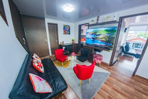 Μια τηλεόραση ή/και κέντρο ψυχαγωγίας στο Lujoso Apartamento en Zona de Comercio