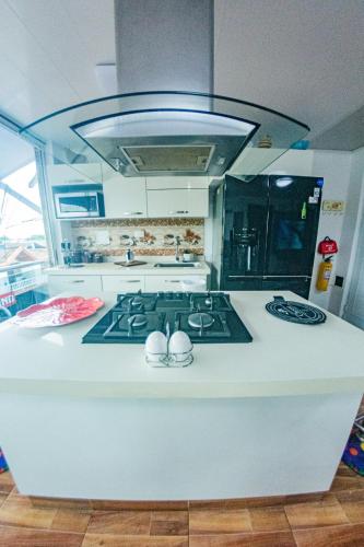 Η κουζίνα ή μικρή κουζίνα στο Lujoso Apartamento en Zona de Comercio