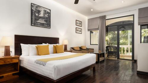 Postel nebo postele na pokoji v ubytování Pavillon d'Orient Boutique Hotel