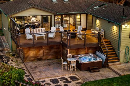 an open deck with a hot tub on a house at Entire Private Coastal Retreat - Spectacular Ocean Views wHot Tub in Montara