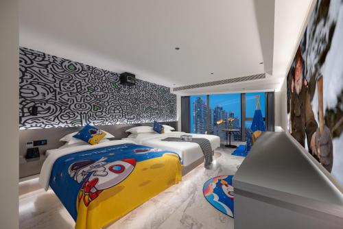 a bedroom with two beds and a mural at 重庆MAX范思酒店解放碑来福士店Chongqing MAX Van Hotel Jiefangbei Raffles in Chongqing