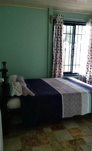 Ένα ή περισσότερα κρεβάτια σε δωμάτιο στο Casa Vera Icon