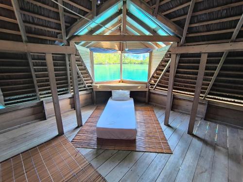 an inside view of a room with a window at Flotopia villa in Yennanas Besir